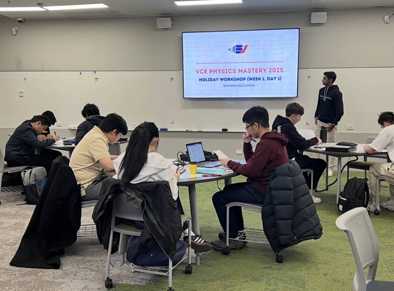 Students working through VCE Physics problems in class