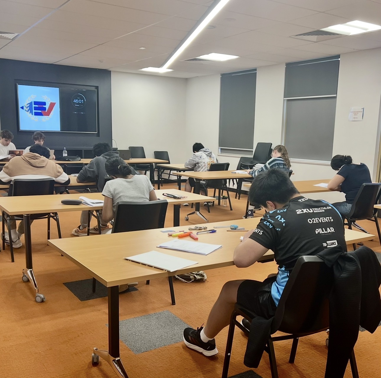 Mock exam classroom with EduVerse branding on screen