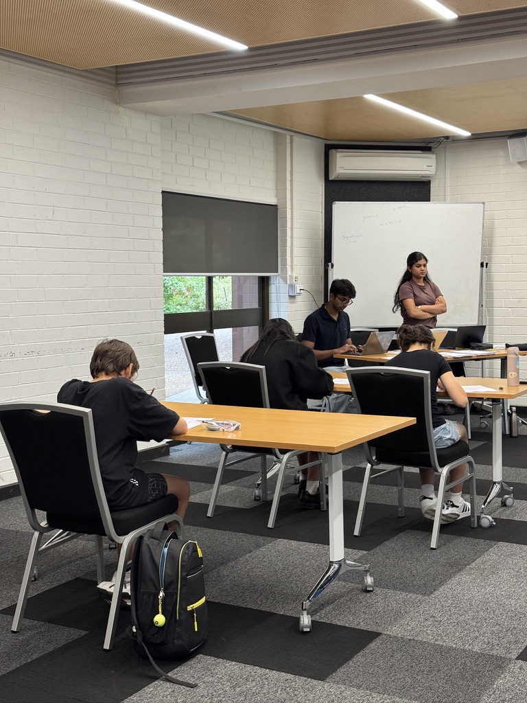 Students working with tutor during a session